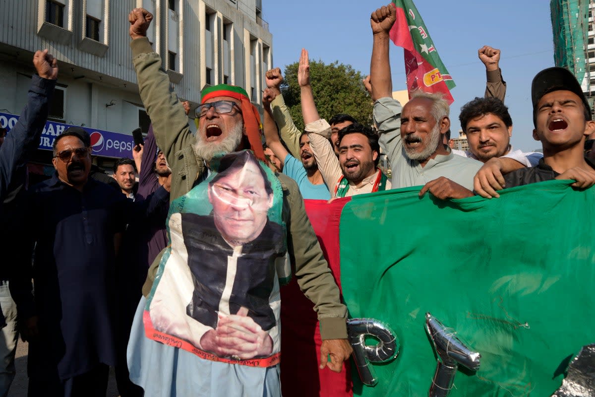 Supporters of Pakistan's Former Prime Minister Imran Khan's party 'Pakistan Tehreek-e-Insaf' chant slogans during a protest against alleged vote-rigging in some constituencies in the parliamentary elections, in Karachi, Pakistan, Sunday, 11 February 2024 (AP)