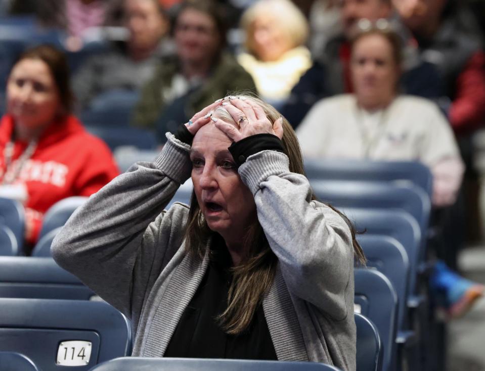 Brockton High School teacher Julie Fairfield reacts to a speaker at a meeting at West Middle School in Brockton with state legislators about severe student behavior problems on Thursday, Feb. 15, 2024.