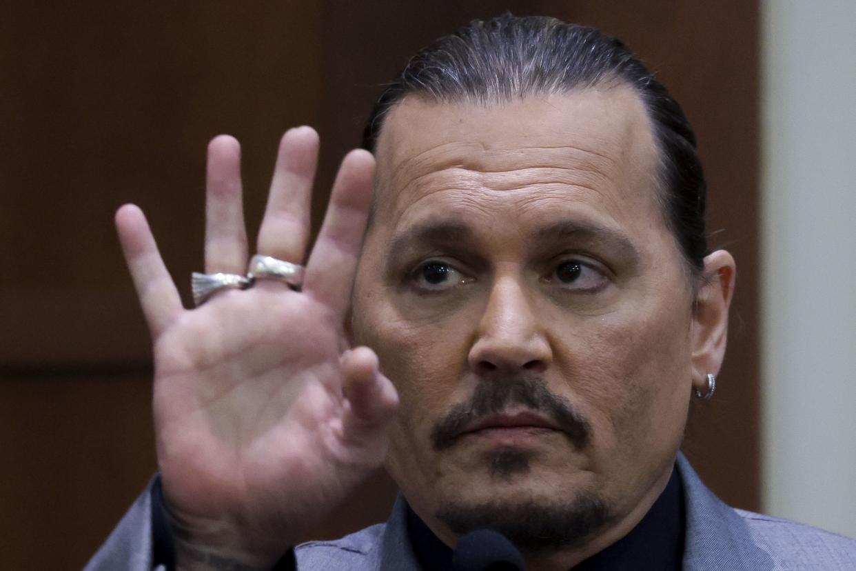 Actor Johnny Depp testifies during a hearing in the courtroom at the Fairfax County Circuit Court in Fairfax, Va. on Wednesday, April 20, 2022.