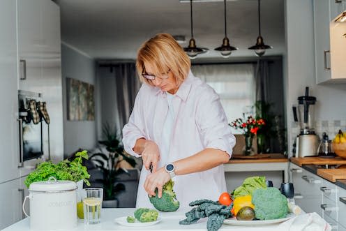 <span class="caption">It's unclear what is driving vegetarians' higher risk of hip fracture.</span> <span class="attribution"><a class="link " href="https://www.shutterstock.com/image-photo/middle-age-woman-cutting-broccoli-while-2148140877" rel="nofollow noopener" target="_blank" data-ylk="slk:Okrasiuk/ Shutterstock;elm:context_link;itc:0;sec:content-canvas">Okrasiuk/ Shutterstock</a></span>