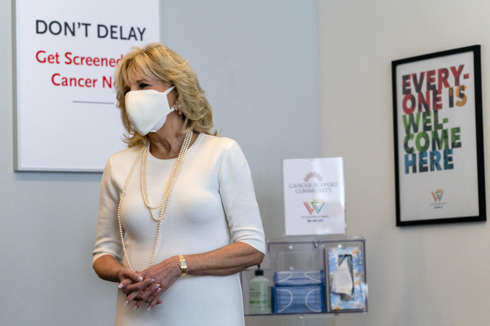 First lady Jill Biden smiles as she tours Whitman-Walker Health, Friday, Jan. 22, 2021, in Washington. (AP Photo/Jacquelyn Martin, Pool)