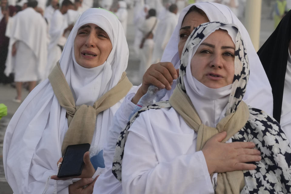 Iranian pilgrims offer prayers at top of the rocky hill known as the Mountain of Mercy, on the Plain of Arafat, during the annual Hajj pilgrimage, near the holy city of Mecca, Saudi Arabia, Saturday, June 15, 2024. Masses of Muslims gathered at the sacred hill of Mount Arafat in Saudi Arabia for worship and reflection on the second day of the Hajj pilgrimage. The ritual at Mount Arafat, known as the hill of mercy, is considered the peak of the Hajj. It's often the most memorable event for pilgrims, who stand shoulder to shoulder, asking God for mercy, blessings, prosperity and good health. Hajj is one of the largest religious gatherings on earth.(AP Photo/Rafiq Maqbool)