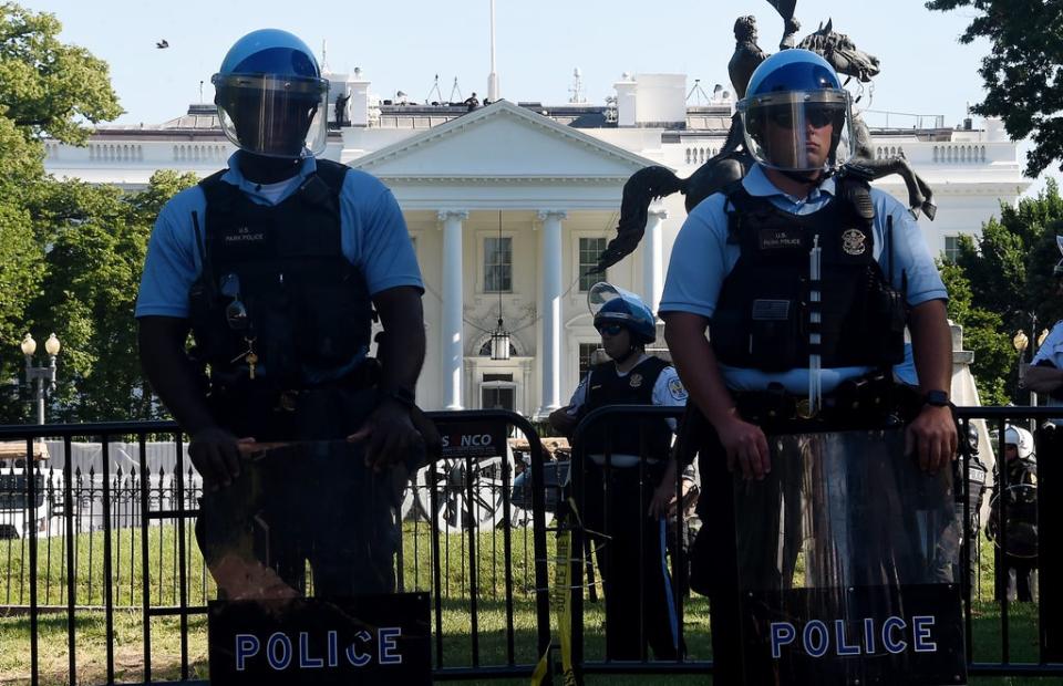 Police hold a perimeter near the White House as demonstrators gather to protest the killing of George Floyd on June 1, 2020 in Washington, DC (AFP via Getty Images)