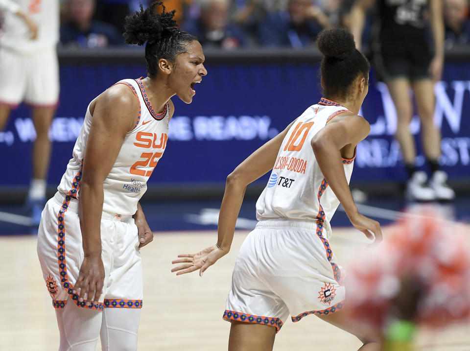 Connecticut Sun's Alyssa Thomas (25) celebrates a basket against the New York Liberty with Olivia Nelson-Ododa (10) during the first half of a WNBA basketball game Tuesday, June 27, 2023, in Uncasville, Conn. (Sarah Gordon/The Day via AP)