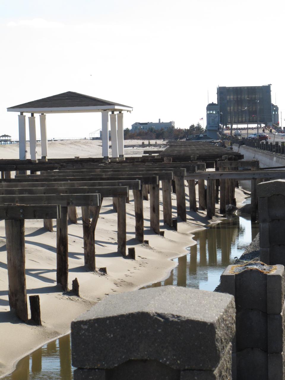 This Feb. 12, 2013 photo shows the remains of the Avon, N.J. boardwalk, looking south toward Belmar. Dogged by legal and environmental woes, Avon is lagging behind some other Jersey shore towns in terms of quickly rebuilding boardwalks damaged by Superstorm Sandy. (AP Photo/Wayne Parry)