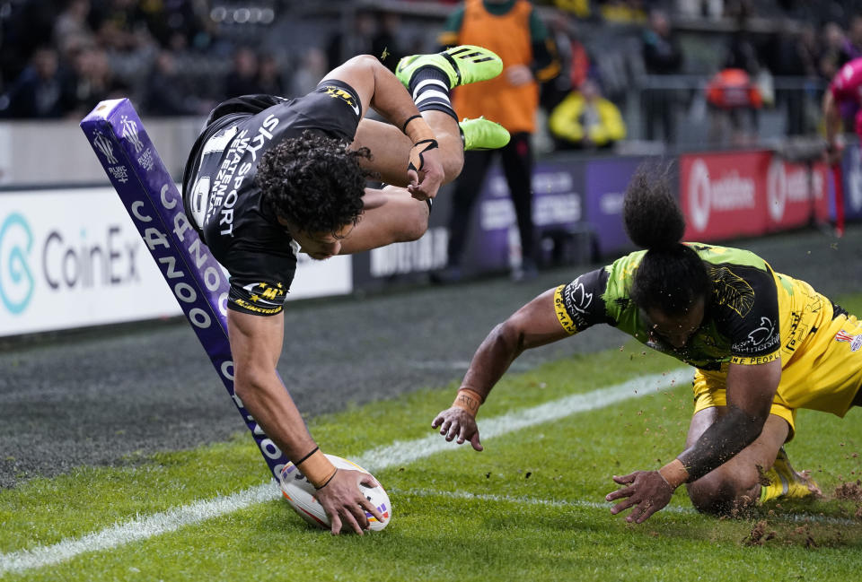 New Zealand's Dallin Watene-Zelezniack scores a try during the Rugby League World Cup group C match between New Zealand and Jamaica at the MKM Stadium, Kingston upon Hull, England, Saturday Oct. 22, 2022. (Danny Lawson/PA via AP)