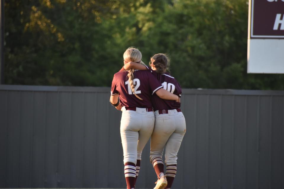 Cassa Arnold (12) and Italia Kyle (10) celebrate after Alcoa softball beat Marion County in the Class 2A sectional game May 20, 2022.