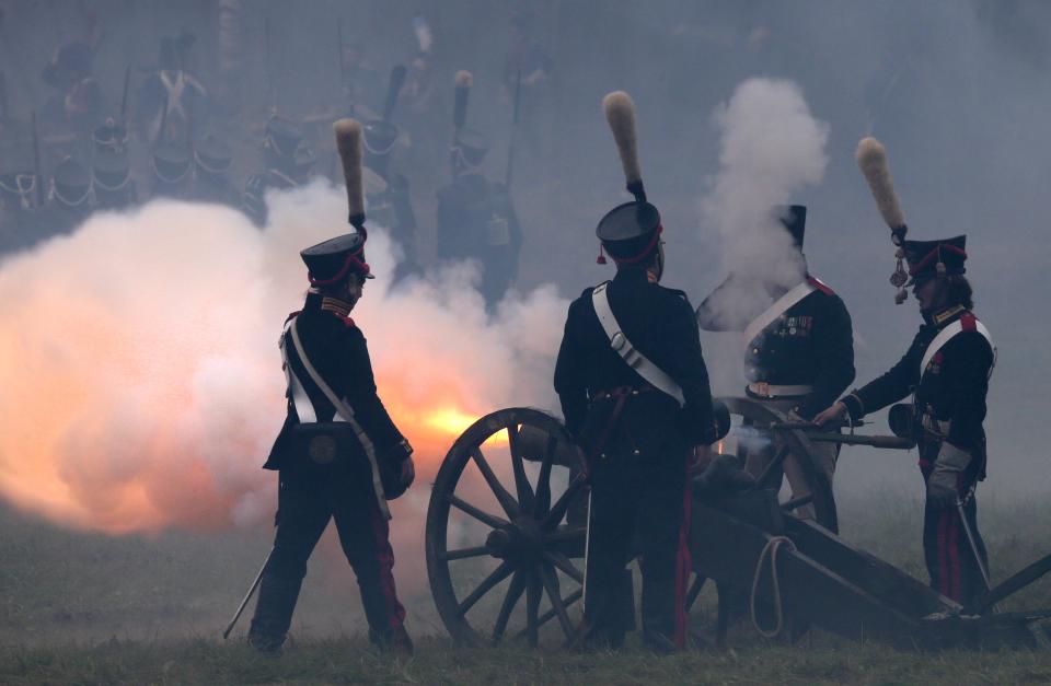 Members of historic clubs wearing 1812-era uniforms take part in a in a staged battle re-enactment to mark the 200th anniversary of the battle of Borodino, in Borodino, about 110 km (70 miles) west of Moscow, Sunday, Sept. 2, 2012. The Battle of Borodino in 1812 was the largest and bloodiest single-day action of the French invasion of Russia. (AP Photo/Mikhail Metzel)