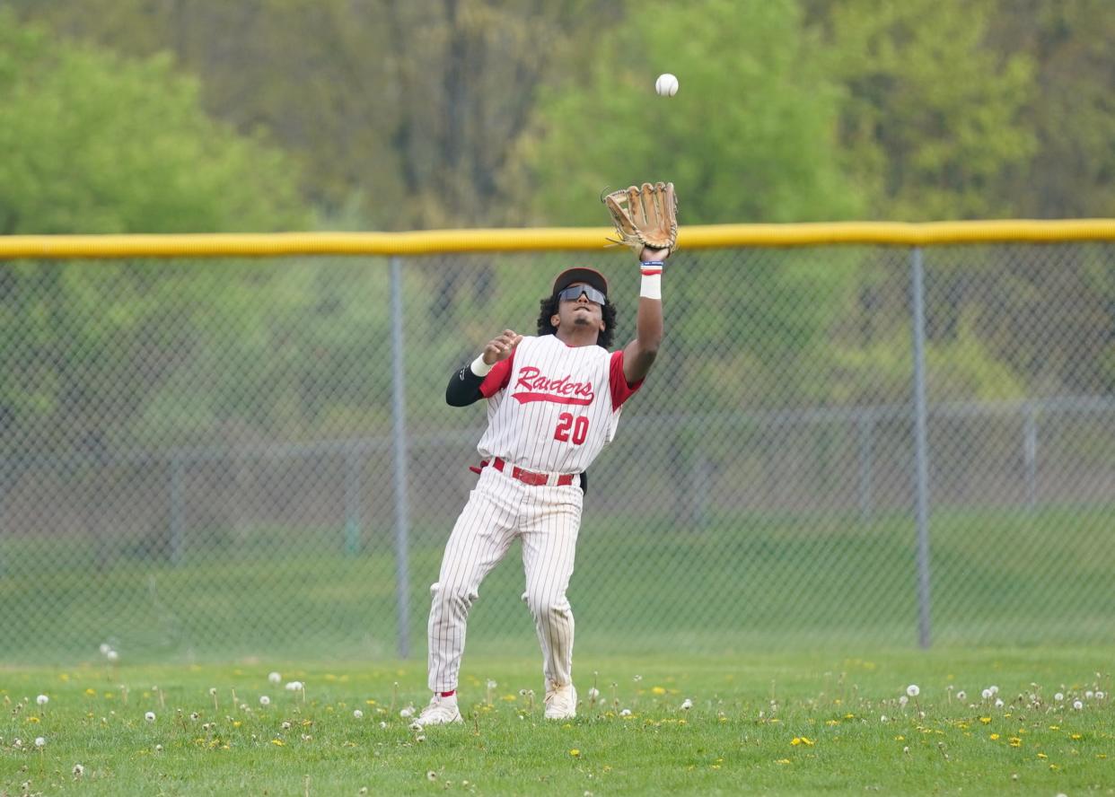 North Rockland left fielder Jacob Herrera (20) pulls in a fly ball during their 9-1 win over Suffern in baseball action at North Rockland High School on Thursday, April 27, 2023. 