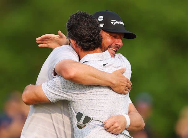 PHOTO: Michael Block, PGA of America Club Professional, and Rory McIlroy congratulate each other on the 18th green during the final round of the 2023 PGA Championship at Oak Hill Country Club on May 21, 2023 in Rochester, N.Y. (Andrew Redington/Getty Images)