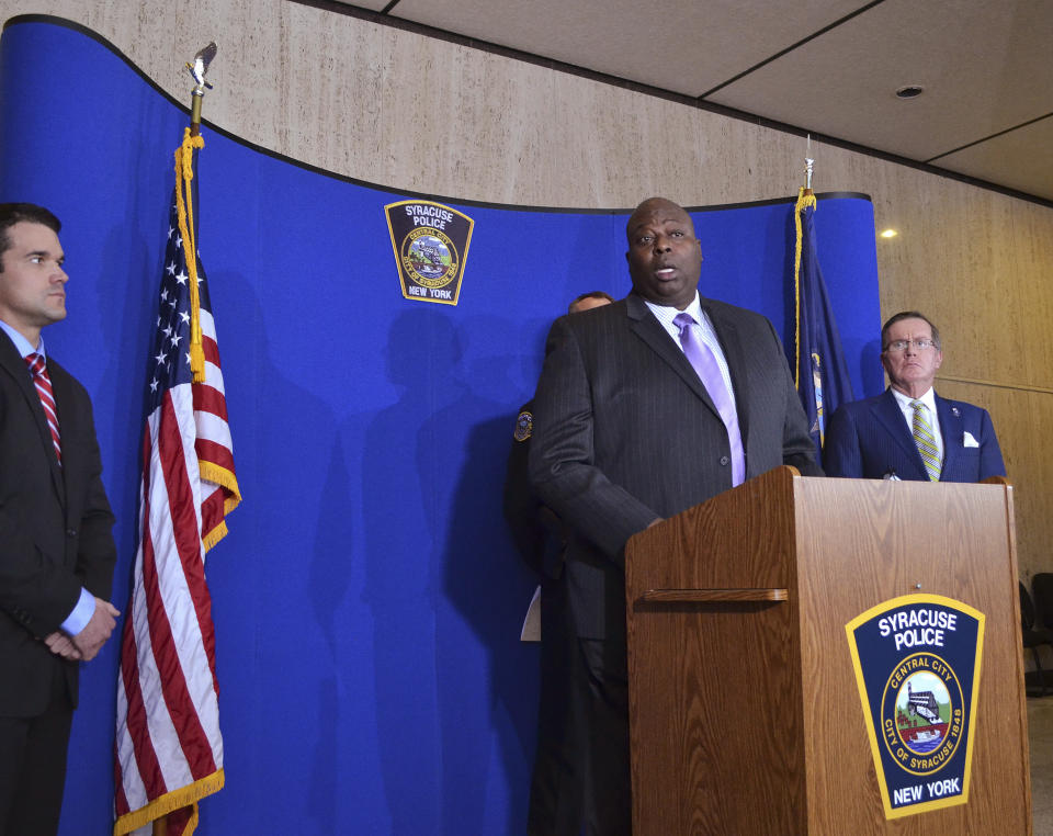 Syracuse Police Chief Kenton T. Buckner, center, speaks during a news conference about Syracuse men's basketball coach Jim Boeheim, Thursday, Feb. 21, 2019, in Syracuse, N.Y. Boeheim struck and killed a man along an interstate late Wednesday night as he tried to avoid hitting the man's disabled vehicle, police say. (AP Photo/Nick Lisi)