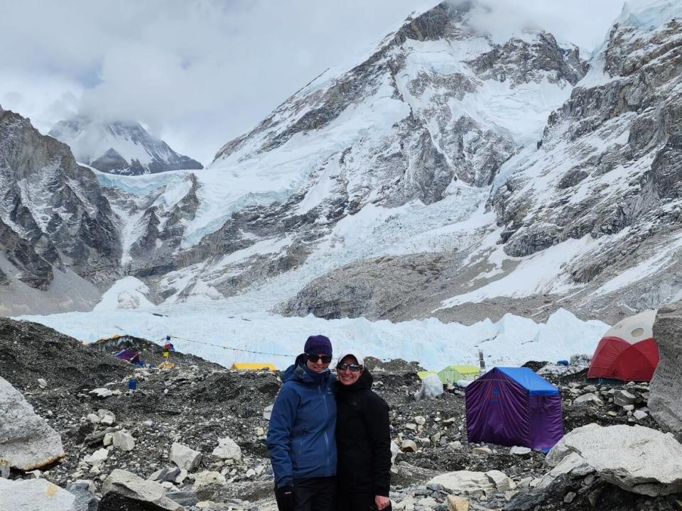 Charlene Feehan Hiscock and Krista Winsor Maloney stand near tents at the south Mount Everest base camp in Nepal.  (Submitted by Krista Winsor Maloney  - image credit)