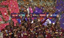 Cricket - England v West Indies - World Twenty20 cricket tournament final - Kolkata, India - 03/04/2016. West Indies players celebrate with the trophy after winning the final. REUTERS/Adnan Abidi