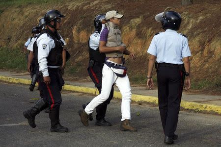 A man is detained by police during a protest against the government in San Cristobal January 15, 2015. REUTERS/Carlos Eduardo Ramirez