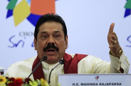 Sri Lankan President Mahinda Rajapaksa gestures as he speaks during a news conference at the Commonwealth Heads of Government Meeting (CHOGM) in Colombo November 17, 2013. REUTERS/Dinuka Liyanawatte