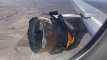 In this image taken from video, the engine of United Airlines Flight 328 is on fire after after experiencing "a right-engine failure" shortly after takeoff from Denver International Airport, Saturday, Feb. 20, 2021, in Denver, Colo. The flight landed safely and none of the passengers or crew onboard were hurt. (Chad Schnell via AP)
