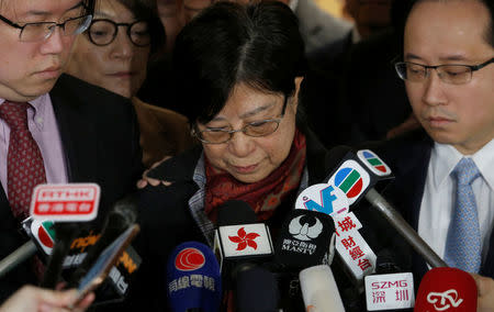 Selina Tsang, wife of former Hong Kong Chief Executive Doanld Tsang, accompanied by sons Simon (L) and Thomas, meets journalists at the High Court in Hong Kong, China February 22, 2017. REUTERS/Bobby Yip