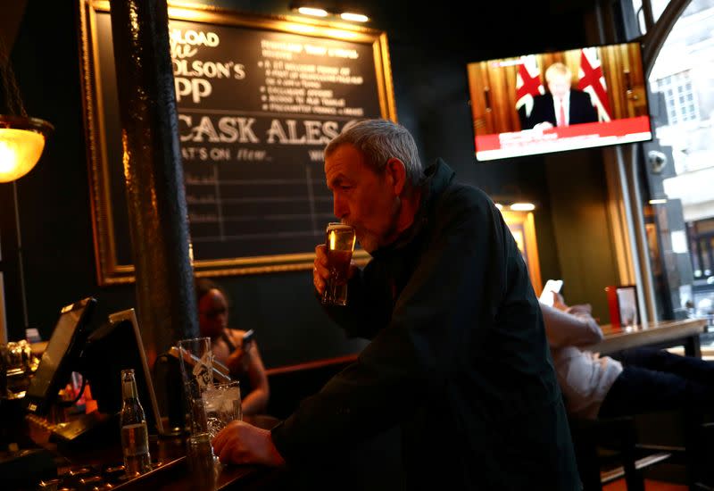 FILE PHOTO: Britain's Prime Minister Boris Johnson seen on television in a pub in London