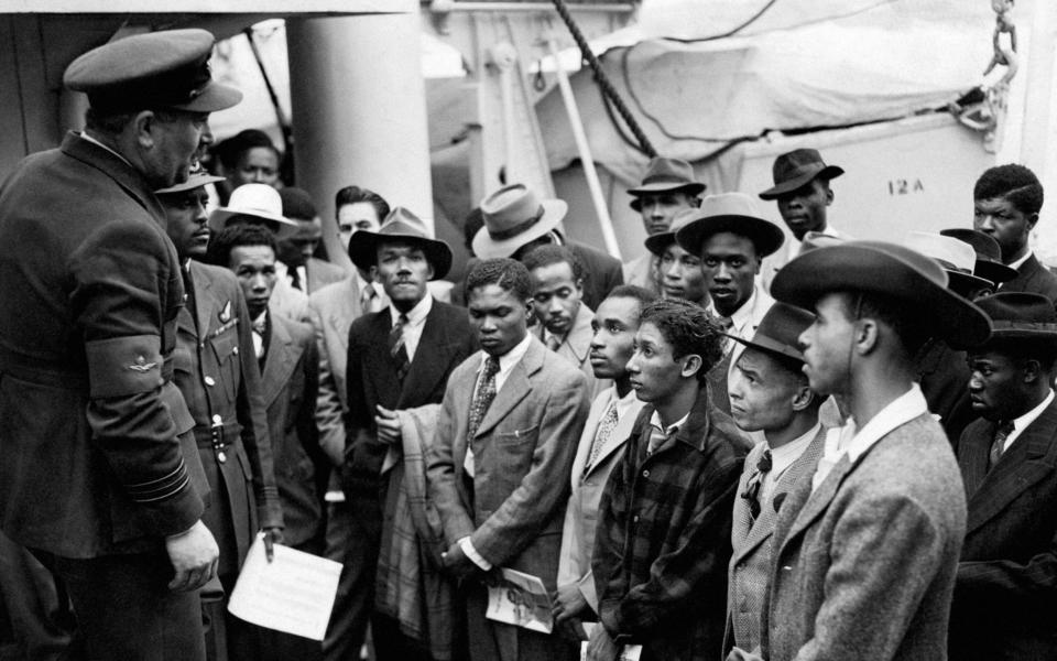 Jamaican migrants after disembarking from the Windrush at Tilbury docks in 1948 - PA