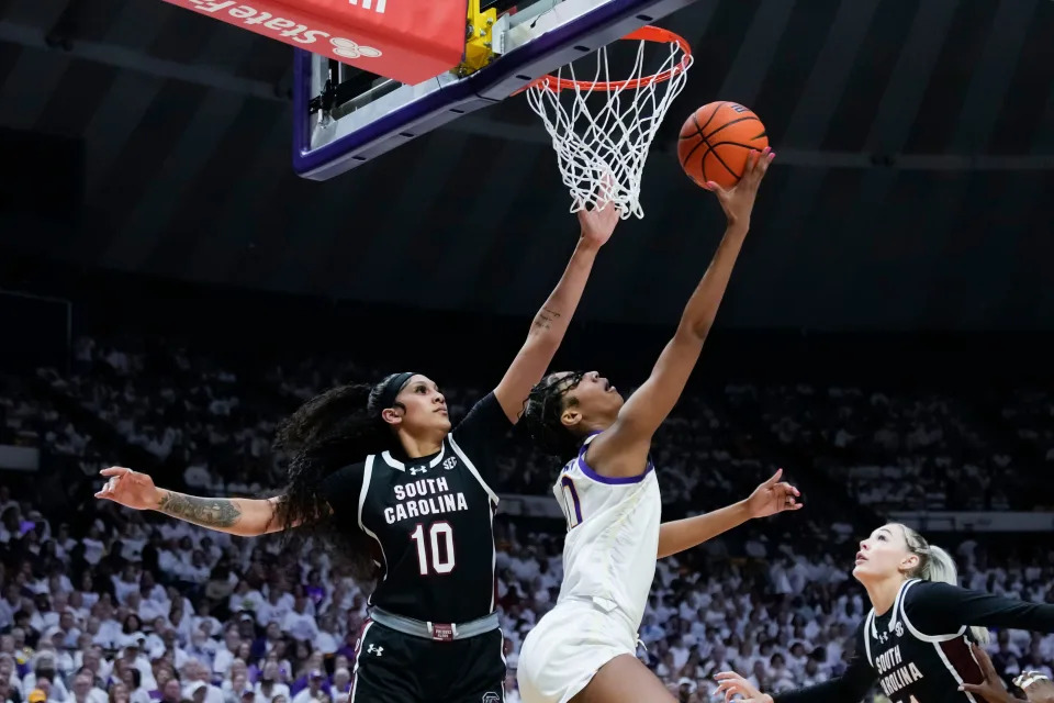 LSU forward Angel Reese goes to the basket against South Carolina center Kamilla Cardoso.