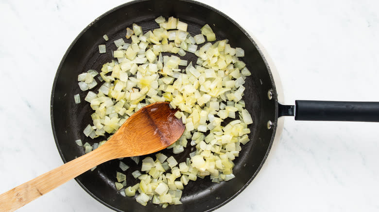 Onion frying in pan