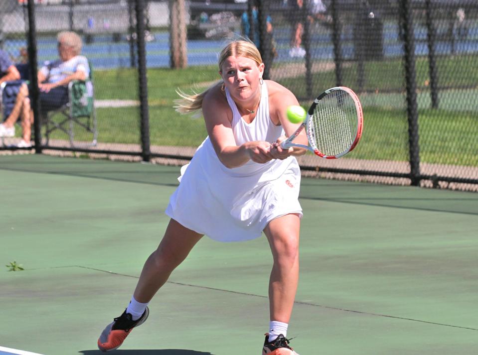 Rylee Carver reaches out to connect for a return shot in prep tennis action on Wednesday.