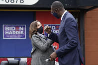 Democratic vice presidential candidate Sen. Kamala Harris, D-Calif., and Michigan Lt. Gov. Garlin Gilchrist II greet one another at Headliners Barbershop in Detroit, Tuesday, Sept. 22, 2020. (AP Photo/Paul Sancya)