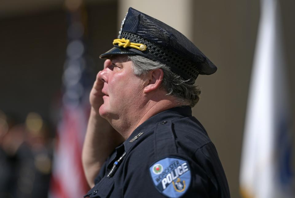 Worcester Police Sgt. Don LaRange salutes the flag at half mast near the close of  Sunday's police memorial ceremony. LaRange, who has been on the force for 35-plus years, comes from a family of police officers, including his brother, Frank LaRange Jr., who died in 2021.