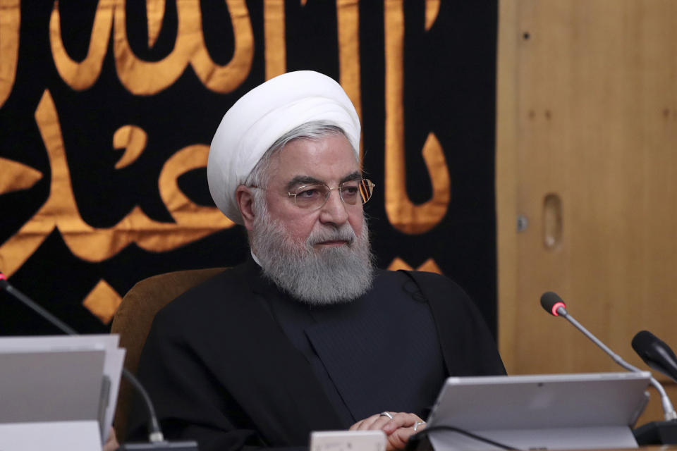 In this photo released by the official website of the office of the Iranian Presidency, President Hassan Rouhani heads a cabinet meeting in Tehran, Iran, Wednesday, Sept. 11, 2019. Rouhani urged the U.S. on Wednesday to "put warmongers aside" as tensions roil the Persian Gulf amid an escalating crisis between Washington and Tehran in the wake of the collapsing nuclear deal with world powers. (Iranian Presidency Office via AP)