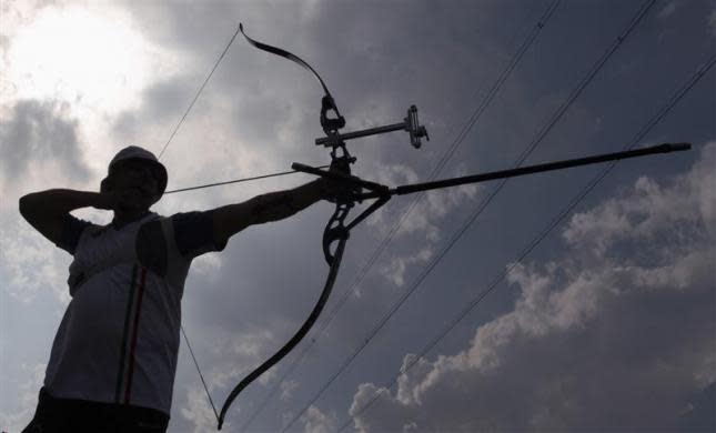 Italian Olympic team archer Marco Galiazzo prepares to release an arrow during a training session in Padua, northern Italy, April 21, 2012. Galiazzo won the gold medal in the men's individual archery event at the Athens 2004 Olympic Games, and will take part in the London 2012 Olympic Games.