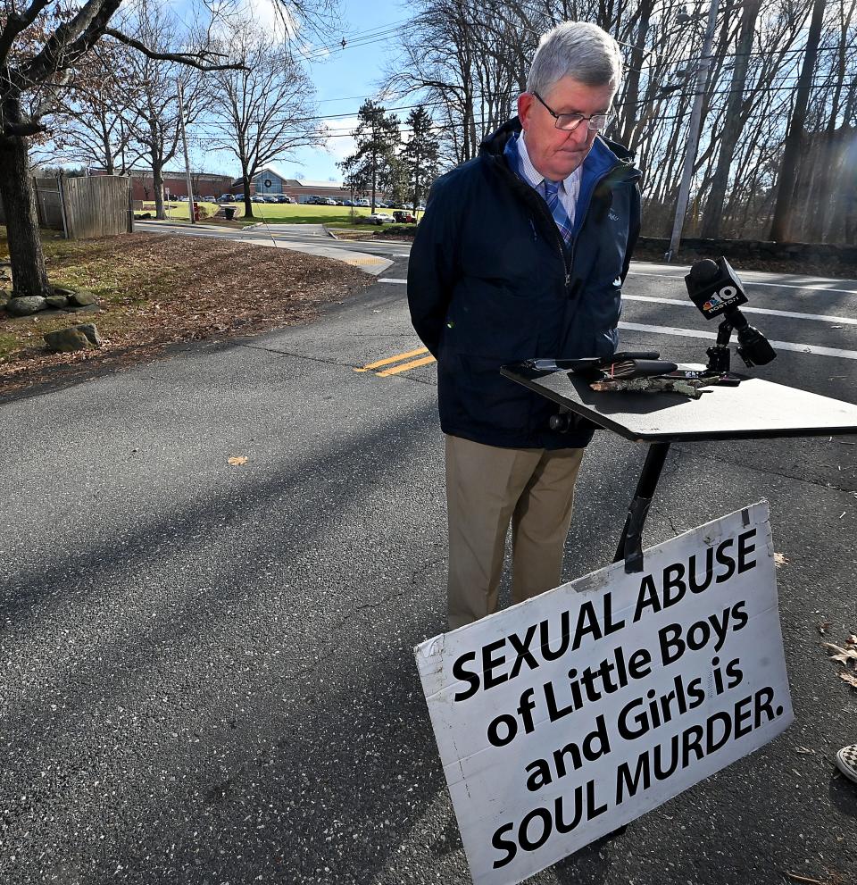 SHREWSBURY - Across the street from St. John's High School on Wednesday, Robert Hoatson, president of Road to Recovery, a New Jersey sex-abuse survivor organization, listens to a Zoom call that includes former students who said they were abused at the school years ago.