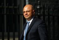 Britain's Home Secretary Sajid Javid arrives at Downing Street, in London