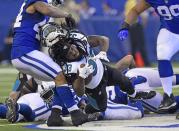 <p>Jacksonville Jaguars running back Chris Ivory (33) has his helmet ripped off by Indianapolis Colts linebacker Antonio Morrison (44) at Lucas Oil Stadium. Mandatory Credit: Thomas J. Russo-USA TODAY Sports </p>