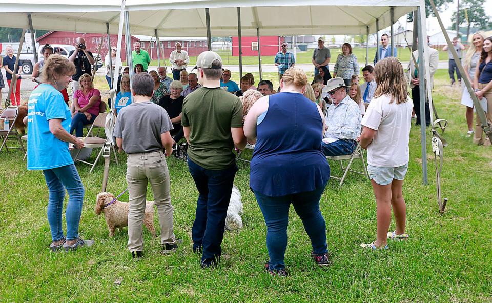 Homeward Bound of Ashland County secretary Dianne Hammontree, left, speaks at the groundbreaking ceremony  the new Ashland County Dog Shelter on Baney Road on Tuesday, June 14, 2022. TOM E. PUSKAR/ASHLAND TIMES-GAZETTE