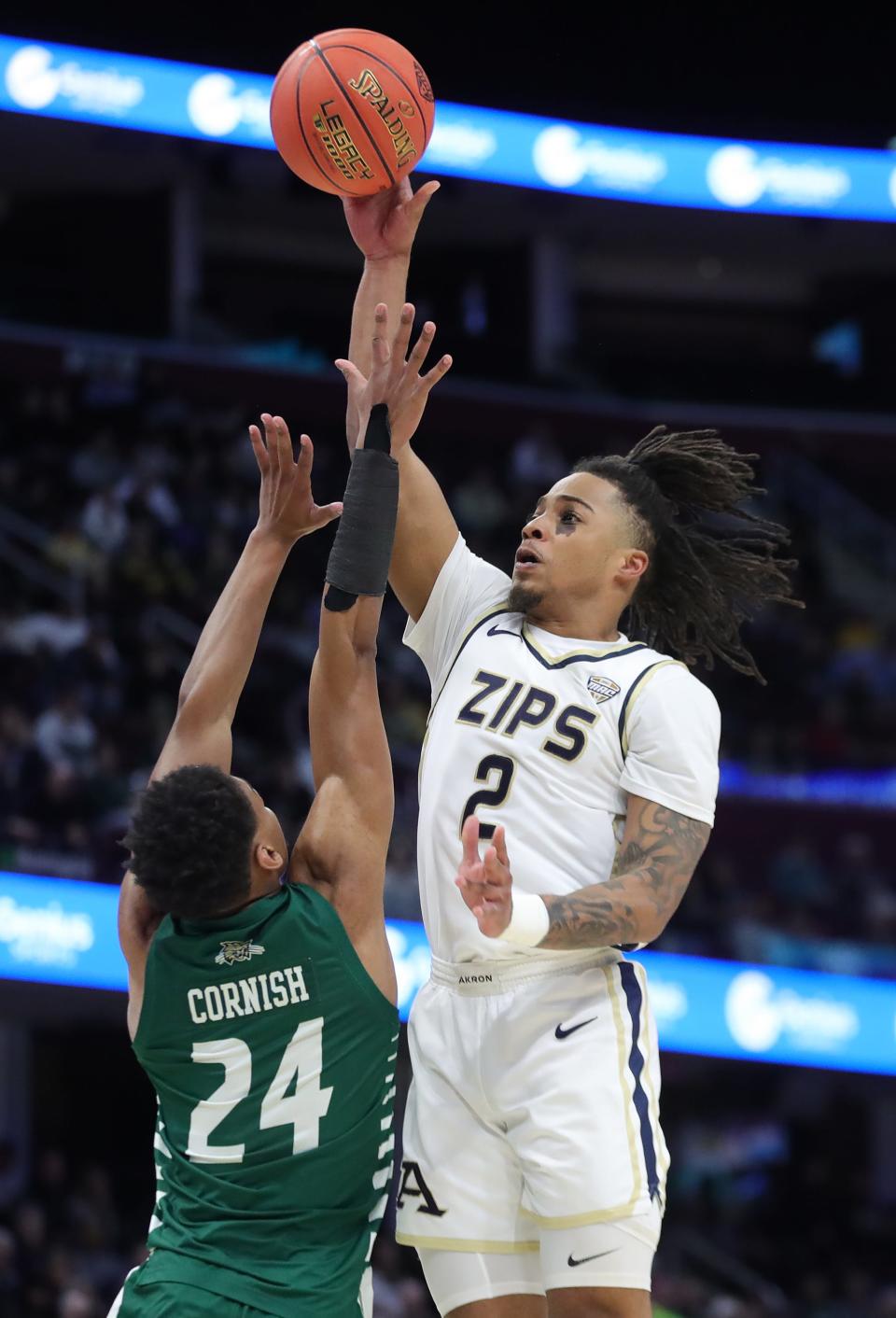 Akron's Greg Tribble (2) shoots over Ohio's Ike Cornish (24) in the semifinals of the Mid-American Conference Tournament on Friday in Cleveland.