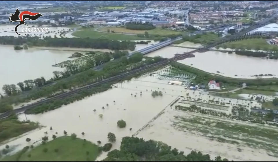This photo provided by the Italian Carabinieri police shows flooded fields in the northern Italian region of Emilia Romagna, Wednesday, May 17, 2023. Unusually heavy rains have caused major floodings in Emilia Romagna, where trains were stopped and schools were closed in many towns while people were asked to leave the ground floors of their homes and to avoid going out. (Carabinieri via AP)