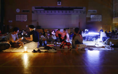 Evacuees are seen at a gymnasium of elementary school, acting as an evacuation shelter, during blackout after an earthquake hit the area in Sapporo, Hokkaido. Kyodo/via REUTERS