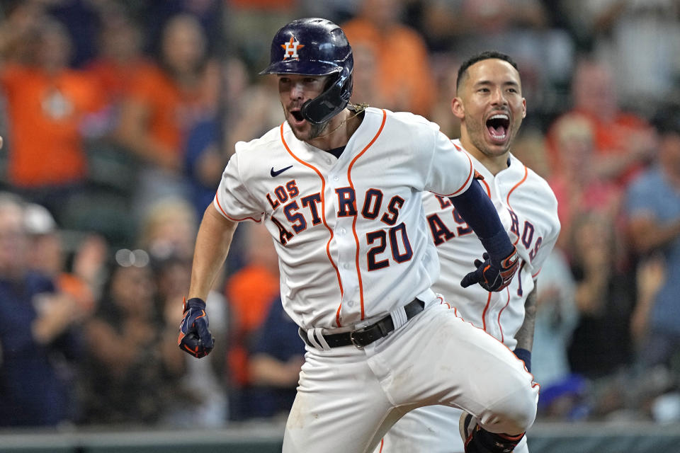 Houston Astros' Chas McCormick (20) celebrates with Carlos Correa (1) after hitting a home run against the Arizona Diamondbacks during the eighth inning of a baseball game Sunday, Sept. 19, 2021, in Houston. (AP Photo/David J. Phillip)