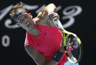 Spain's Rafael Nadal serves to Bolivia's Hugo Dellien during their first round singles match at the Australian Open tennis championship in Melbourne, Australia, Tuesday, Jan. 21, 2020. (AP Photo/Lee Jin-man)