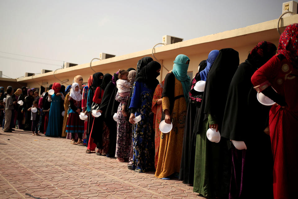Women who queue to receive food