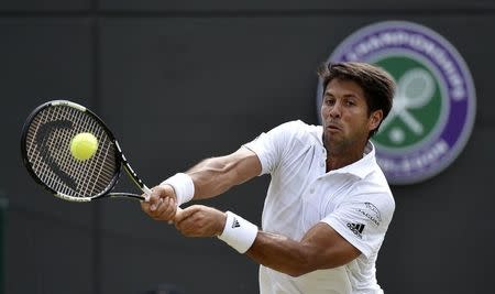 Fernando Verdasco of Spain hits a shot during his match against Stan Wawrinka of Switzerland at the Wimbledon Tennis Championships in London, July 3, 2015. REUTERS/Toby Melville