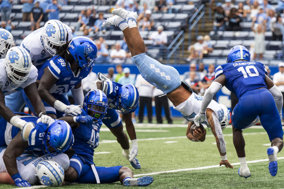 North Carolina running back Omarion Hampton dives over the pile for a touchdown in the second half of an NCAA college football game against Georgia State Saturday, Sept. 10, 2022, in Atlanta. (AP Photo/Hakim Wright Sr.)