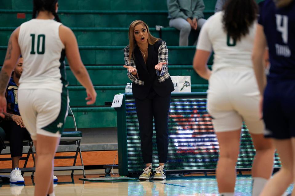 Jacksonville University women's basketball coach Special Jennings gives instructions to Edyn Battle (10) and Julen Royale (0) during a Feb. 17 game at Swisher Gym against North Florida. The Dolphins won four games in a row late in the season to qualify for the ASUN tournament.