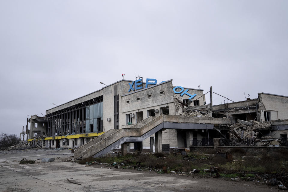 A building, part of the Kherson international airport is seen damaged during fighting between Ukrainian and Russian forces in Kherson, Ukraine, Friday, Dec. 2, 2022. (AP Photo/Evgeniy Maloletka)