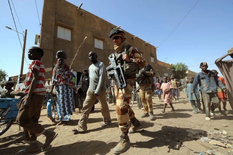 French troops patrol in the streets of Gao on February 3, 2013. France said it carried out major air strikes Sunday near Kidal, the last bastion of armed extremists chased from Mali's desert north in a lightning French-led offensive, after a whirlwind visit by President Francois Hollande