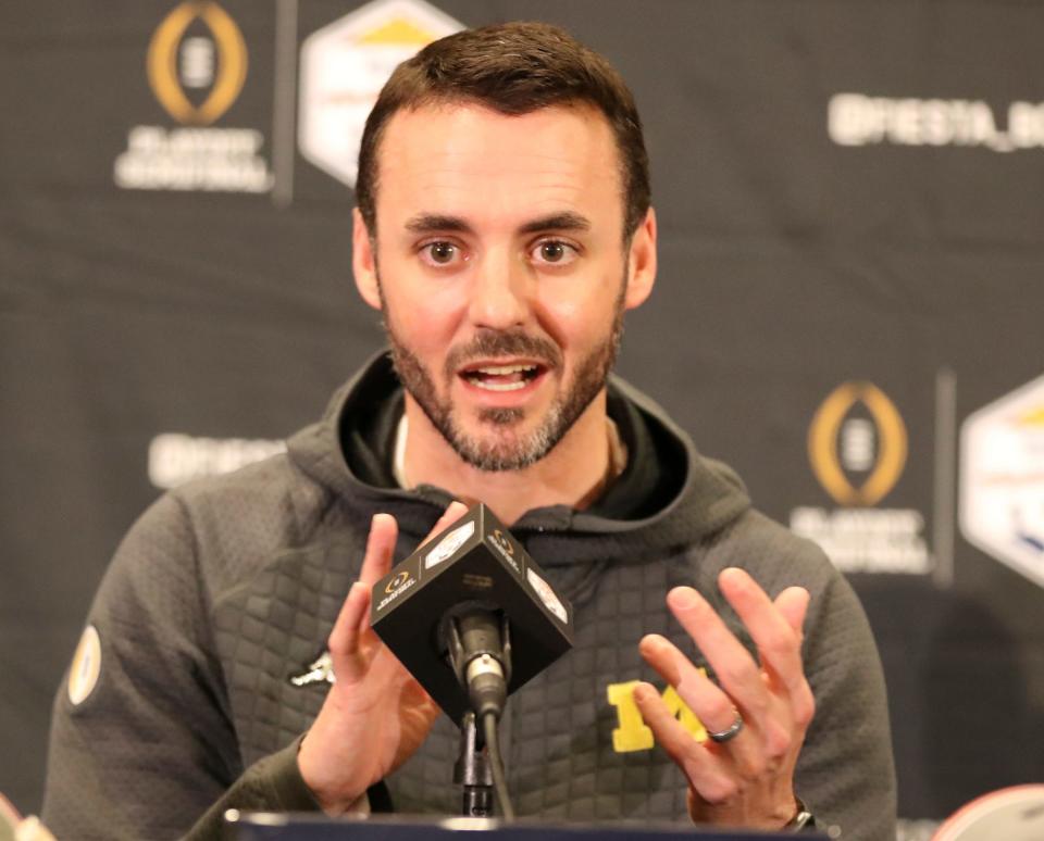 Michigan defensive coordinator Jesse Minter talks with reporters about the Fiesta Bowl against TCU on Wednesday, Dec. 28, 2022, in Scottsdale, Arizona.