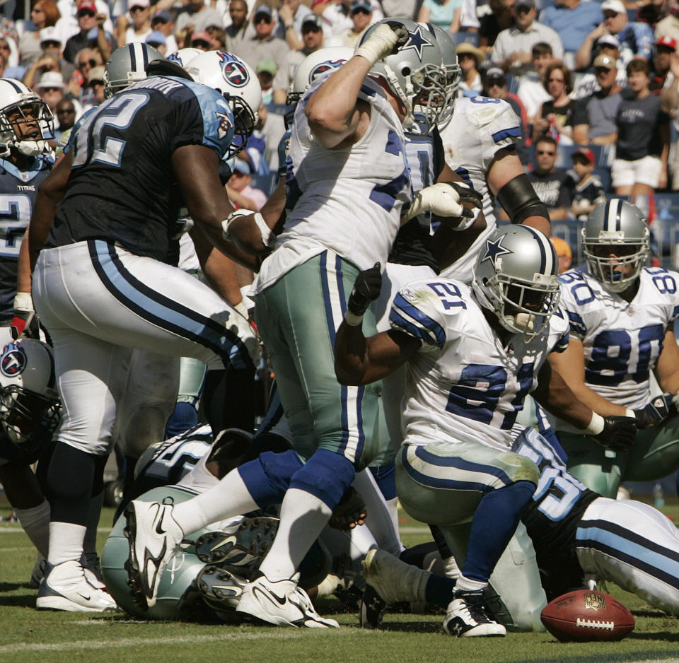 FILE - In this Oct. 1, 2006, file photo, Tennessee Titans defensive tackle Albert Haynesworth, left. stomps the face of Dallas Cowboys center Andre Gurode during the third quarter of their an NFL football game in Nashville, Tenn. Violence is part of the game in many sports. But when the Cleveland’s Myles Garrett ripped the helmet off Mason Rudolph and hit the Pittsburgh Steelers’ quarterback in the head with it, the Browns’ defender crossed a line _ one that attracts the attention of authorities sometimes from within their sport and in other cases from criminal prosecutors. (AP Photo/John Russell, File)