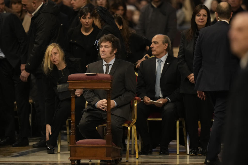From left front row, Argentine Secretary-General of the Presidency Karina Milei, Argentine President Javier Milei, Interior Minister Guillermo Francos, and Minister of Human Capital Sandra Pettovello attend in St. Peter's Basilica at The Vatican, Sunday, Feb. 11, 2024, the canonization of new Argentine Saint, María Antonia de Paz y Figueroa also known as "Mama Antula" presided over by Pope Francis. (AP Photo/Alessandra Tarantino)