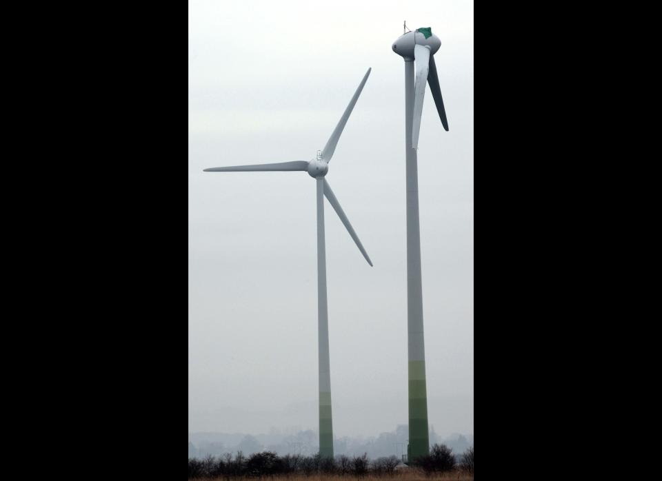 A wrecked wind turbine on farm land in the village of Conisholme, Lincolnshire. The mysterious severance of the wind turbine blade may have been caused by a mechanical failure, an expert said today. Local residents reported seeing a bright light on the morning it happened, prompting speculation that a UFO had caused the damage. But Fraser McLachlan, chief executive of GCube, which insures more than 25,000 wind turbines worldwide, said that although it is unusual, this type of incident happens about five or six times a year. (Photo credit: Chris Radburn/PA Wire)