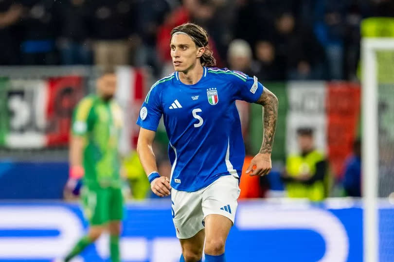 Riccardo Calafiori dribbles forward with the ball while playing for Italy at Euro 2024.